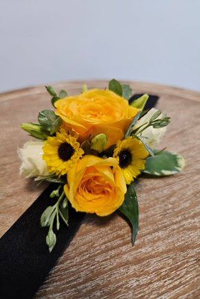 wrist corsage with yellow flowers