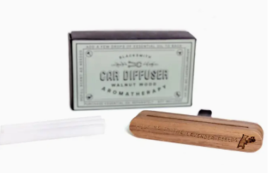 Car diffuser with wooden finish and packaging on a white background