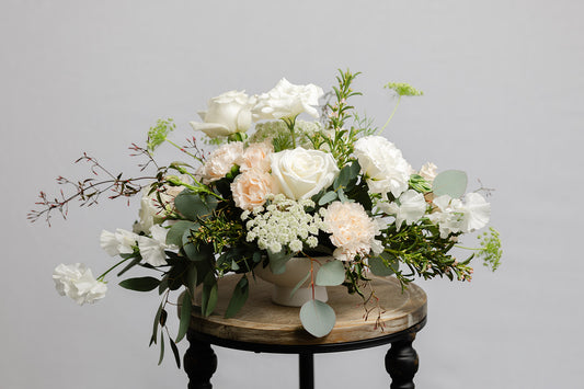 Wedding Centerpiece of white flowers in a footed bowl