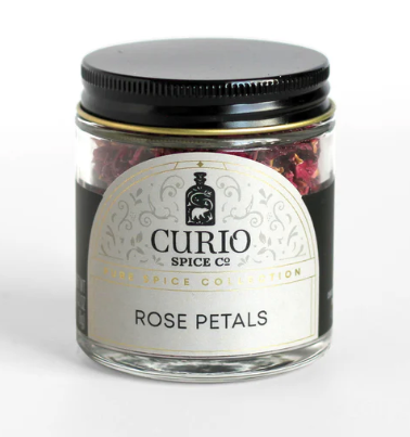 Jar of rose petals from Curio Spice Co on a white background