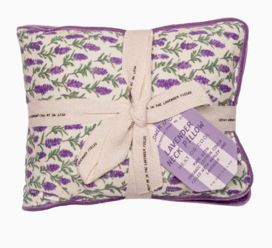 Lavender pillow with floral pattern and tag on a white background