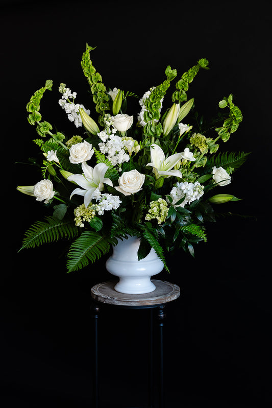 White flower sincere sympathy pedestal arrangement